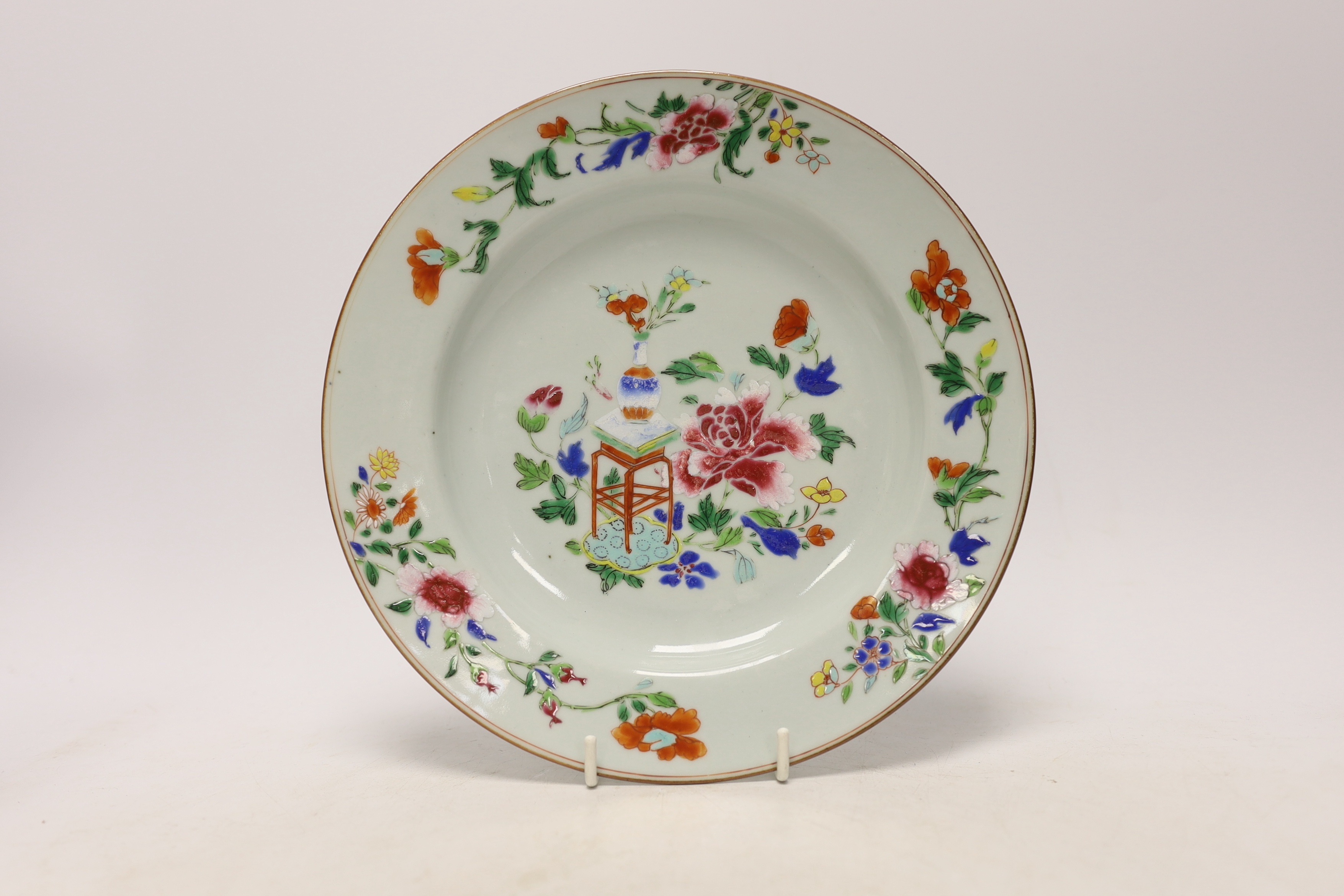 A late 18th century Chinese famille rose plate and a 19th century famille rose plate, largest 24.5cm in diameter